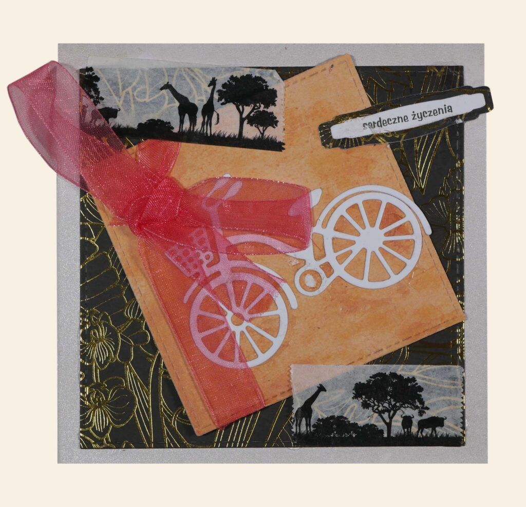 Ozdobna kartka, motywy roślinne i zwierzęce, na środku rower, obok napis: „serdeczne życzenia”.